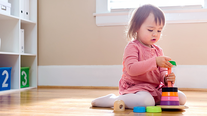 Toddler playing with toys