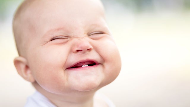 infant with erupt teeth