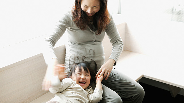Mom playing with her daughter