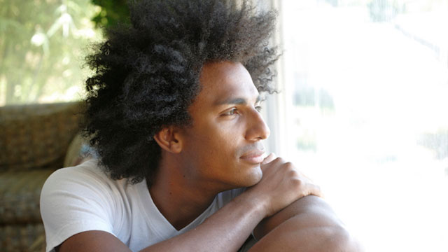 man looking at the window