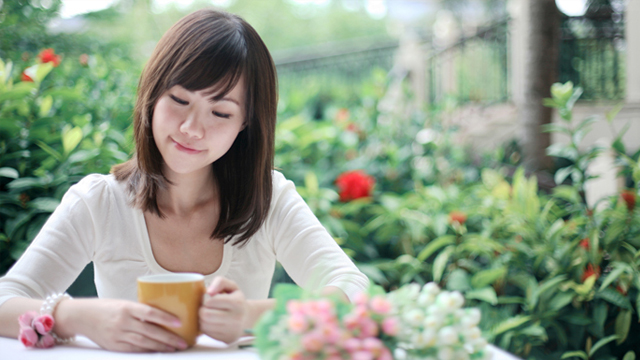 Girl holding cup